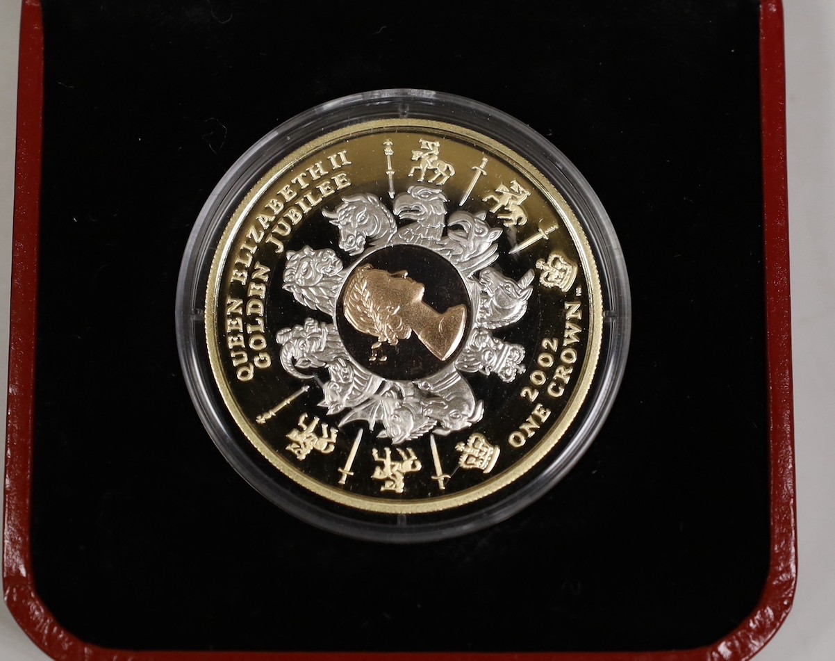 A cased Pobjoy mint tri-gold golden jubilee 1 crown coin, 2002, no. 483/999